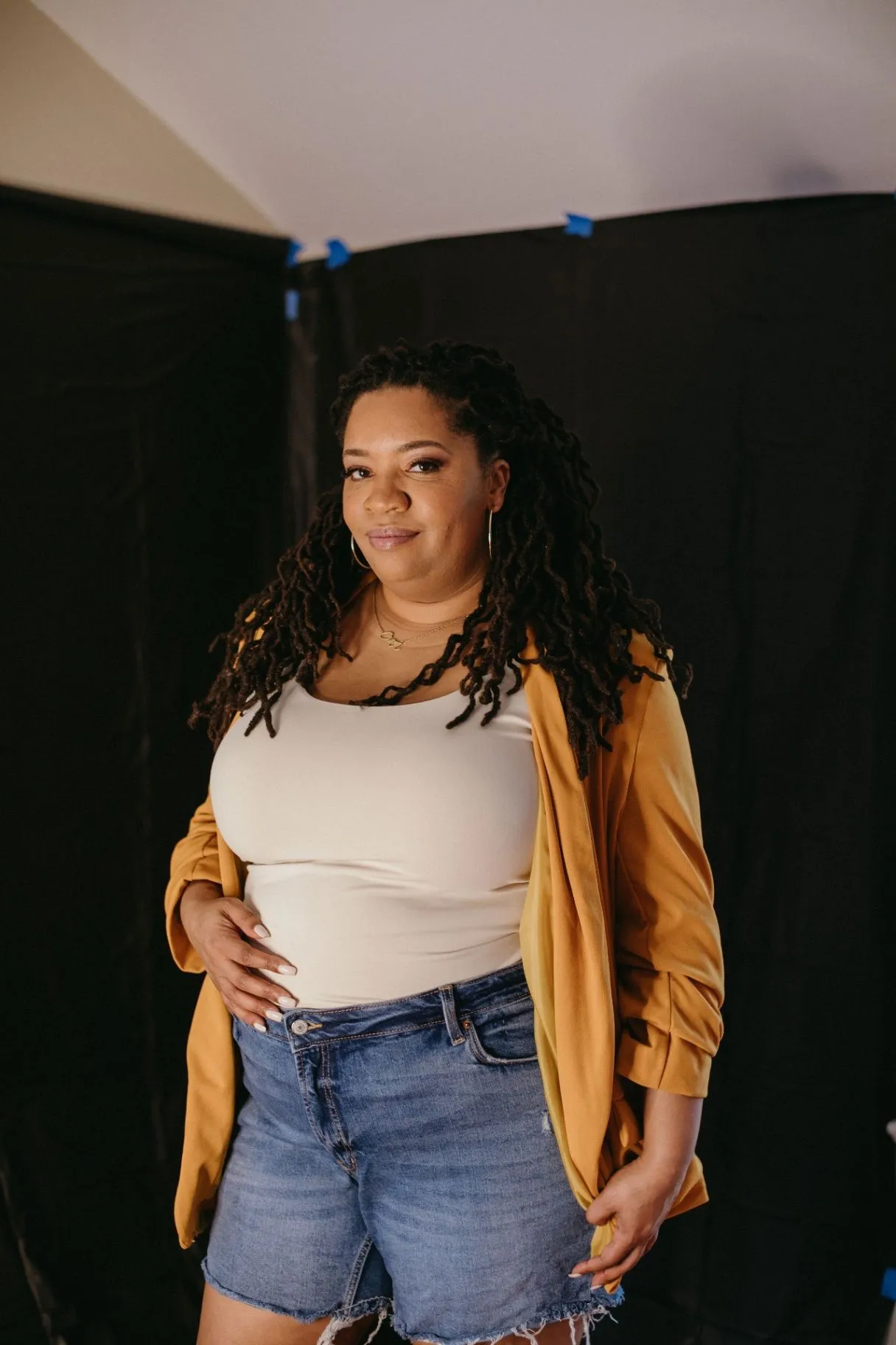 Dr. Marvette Lacy in a warm side-profile portrait wearing a white top